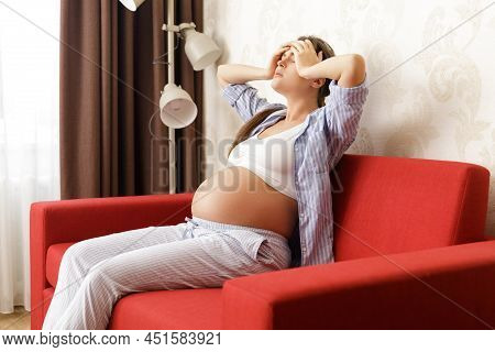 Young And Pregnant Woman Has Painful Headache