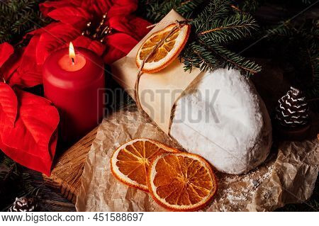 Christmas Stollen On Wooden Background. Traditional Christmas German Dessert Cut Into Pieces. Cake W
