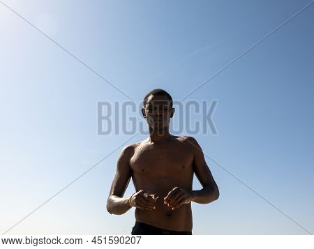 Saly, Mbour, Senegal - Circa December 2021. Unidentified Mature Man Doing Sport Abdominal Musculatio