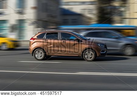 Brown Car Lada Xray Riding At The City Street. Moscow, Russia - October 2021
