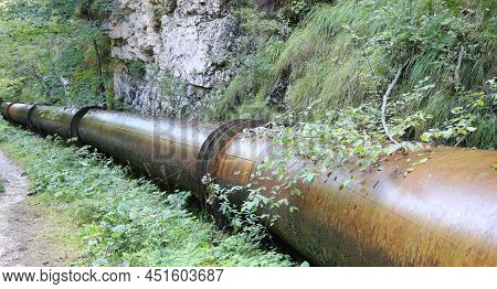 Big Metal Pipe For Transporting The Liquid In The Middle Of The Forest