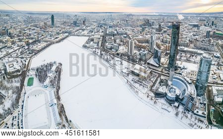 Yekaterinburg Aerial Panoramic View In Winter At Sunset. Yekaterinburg City And Pond In Winter.
