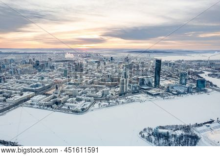 Yekaterinburg Aerial Panoramic View In Winter At Sunset. Yekaterinburg City And Pond In Winter.