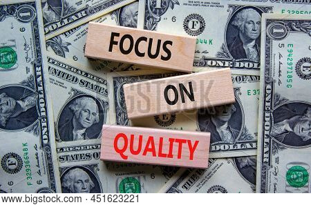 Focus On Quality Symbol. Concept Words Focus On Quality On Blocks On Beautiful Background From Dolla