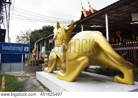 Angel Guardian And Pixiu Or Pi Yao Creatures Of Myth And Legend At Gate Entrance Of Wat Daeng Pracha