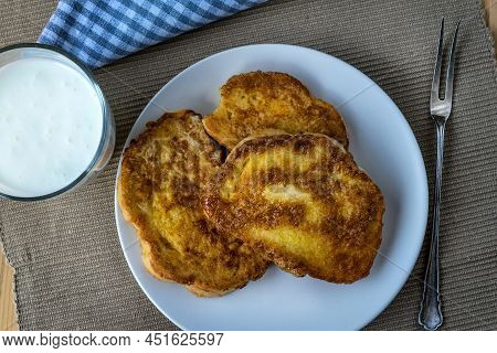 French Toast - Przenice - Slices Of Bread Soaked In Beaten Eggs And Milk And Fried, With A Glas Of Y