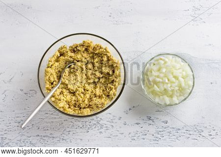 Raw Soaked Green Lentils Punched In Blender And Diced Onions On A Light Gray Background, Top View. C