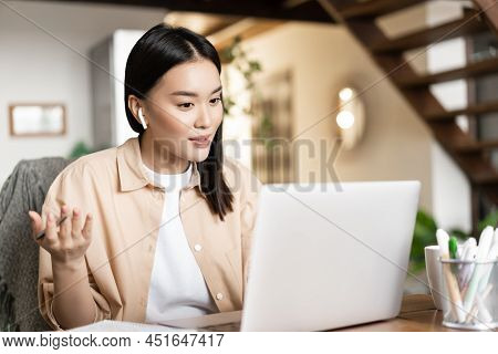 Young Asian Woman Working, Talking On Video Conference, Chatting On Laptop Video Messanger, Has Remo