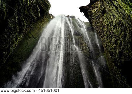 Scenic Cave Of Gljufrafoss Waterfall In Iceland