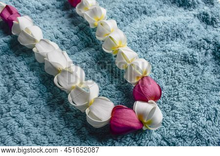 Beautiful Garland Made With Fresh Flowers Of White Champa And Red Champa Or Frangipani Flowers. Hand
