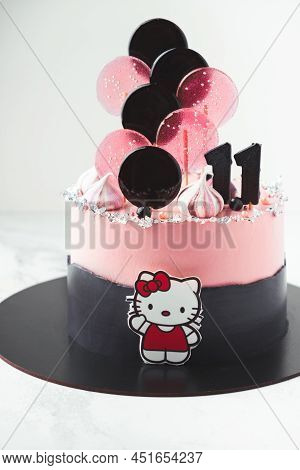 Kyiv, Ukraine - December 10: Birthday Cake With Pink Cream Cheese Frosting And Lollipops On Top. Cak