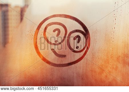 Doodle Happy Smile Face With Question Mark In Their Eyes Painted On Snset Window Flooded With Raindr