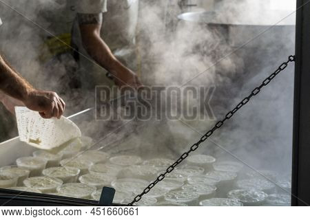 Process Of Making Fresh White Soft Ricotta Whey Cheese On Small Cheese Farm In Parma, Italy