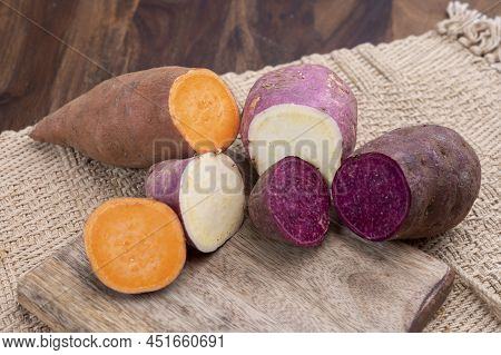 Colorful Root Vegetables Pink, Purple And Orange Organic Sweet Potatos