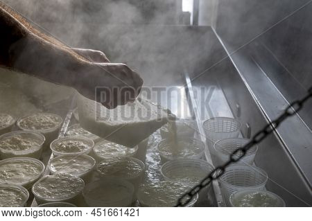 Process Of Making Fresh White Soft Ricotta Whey Cheese On Small Cheese Farm In Parma, Italy