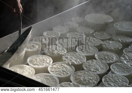 Process Of Making Fresh White Soft Ricotta Whey Cheese On Small Cheese Farm In Parma, Italy