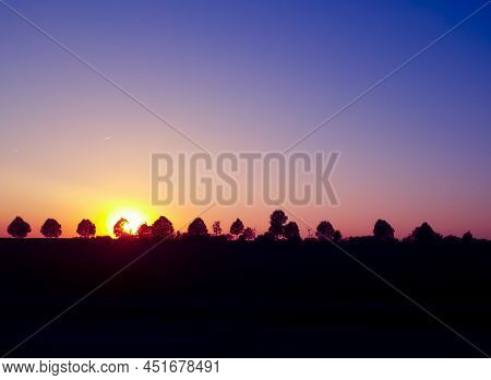 Sunset On A Clear Blue Sky With Copy Space