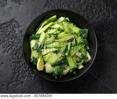 Chinese Fried Pak Choi With Garlic, Sesame Seeds. Healthy Food