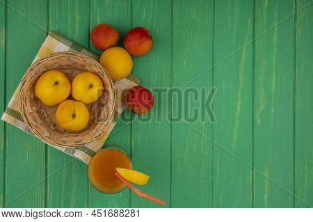 Top View Of Fresh Yellow Peaches On A Bucket On A Checked Cloth With Pinky-orange Peaches With Peach