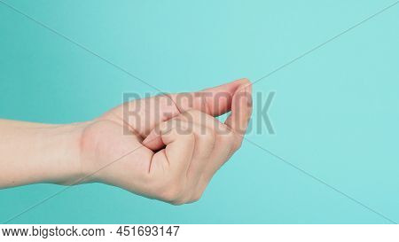 Empty Hand Holding Or Catch Nothing Guesture On Green Mint Background.