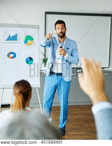 Young Busnessman Having A Speech By A Whiteboard During A Conference Business Meeting In An Office. 