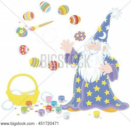 Old Wizard With A Big White Beard Coloring And Decorating Easter Gift Eggs With A Magic Flying Paint