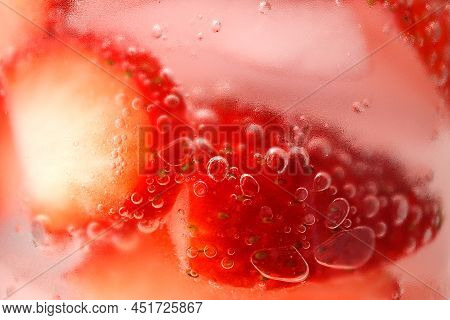 Sliced Strawberries, Ice Cubes, Cold Water, Water Bubbles, Condensation On Glass