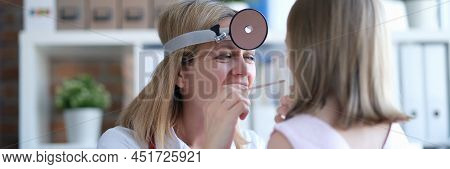 A Joyful Doctor Examines The Childs Nasopharynx. Childrens Colds, Pediatrics. Prevention Of Viral Di