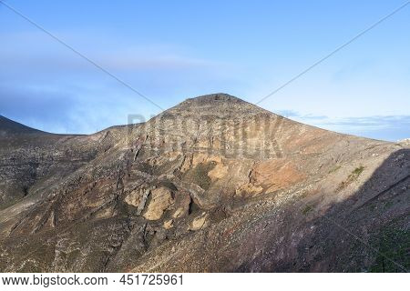 Village Of Femes In Lanzarote In Morning Fog With Blue Sky