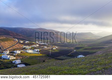 Village Of Femes In Lanzarote In Morning Fog With Blue Sky