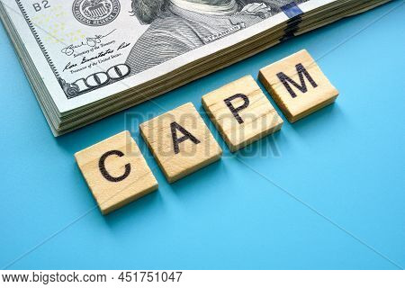 Letters Capm Capital Asset Pricing Model And A Bundle Of Money.