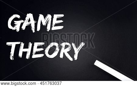 Game Theory Text On A Black Chalkboard With A Piece Of Chalk