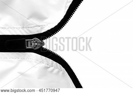 Zip Lock On Clothes With A Place For An Inscription Or Logo. Lock With Lightning On A White Backgrou