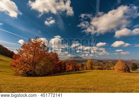 Autumn Mountain Landscape - Yellowed And Reddened Autumn Trees Combined With Green Needles And Blue 