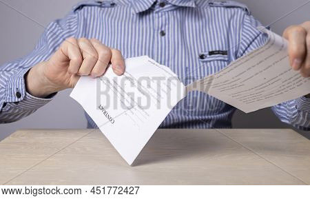 Man Hands Closeup Tearing Contract. Cancellation Of Deal Or Arrangement. Dismissal Concept. Man Sitt