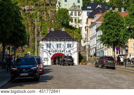 Bergen, Norway - 27 May 2018: Entrance To The Floibanen Cable Car. A White Building On A Green Hill 