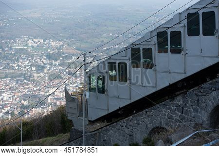Funicluar And Cityscape Of Lourdes In France From Funicular Pic De Jer In Winter.