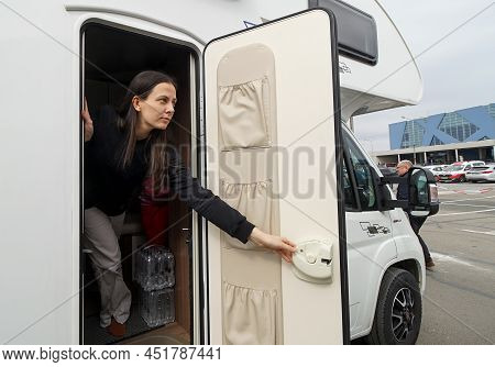 Otopeni, Romania - March 17, 2022: A Mother With Her Daughter War Refugees From Ukraine Rest In A Ca