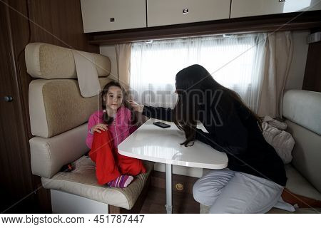 Otopeni, Romania - March 17, 2022: A Mother With Her Daughter War Refugees From Ukraine Rest In A Ca