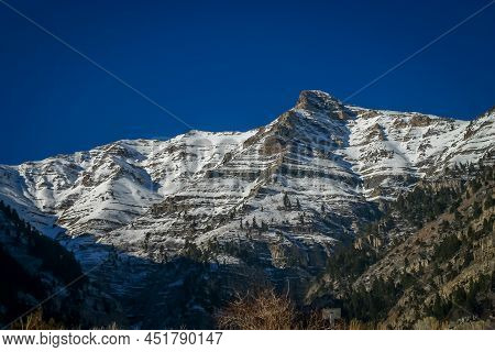 Mountain Peak Covered With Snow In The Spring