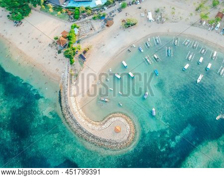 Aerial Drone View Of Ocean, Boats, Beach, Shore In Sanur Beach, Bali, Indonesia With With Traditiona