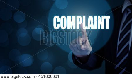 Complaints Concept. Businessman Pointing The Text Complaints Button On Virtual Screens.