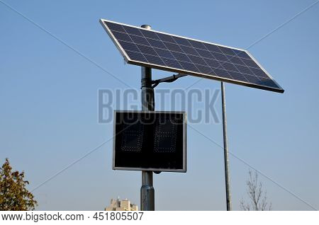Radar To Measure The Speed Of Vehicles In The City. A Reflective Green Sign On A Pole With Led Light