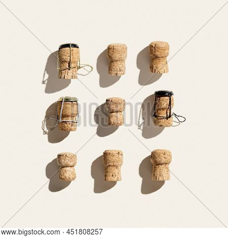 Flat Lay With Set Champagne Corks On Beige Background With Hard Light And Shadows At Sunlight. Minim