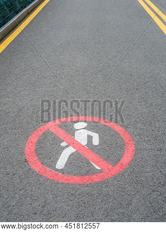 Road Section With Road Markings Regulating The Movement Of Pedestrians. No Pedestrians Allowed. Circ