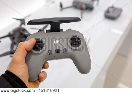 Dji Drone Remote Control In Hand. Buyer Chooses Goods In Dji Store. Minsk, Belarus - February, 2022