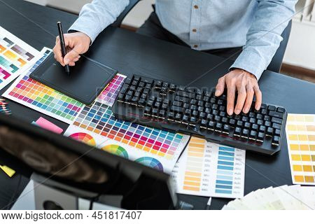 Young Creative Graphic Designer Working On Color Selection And Drawing On Graphics Tablet At Workpla