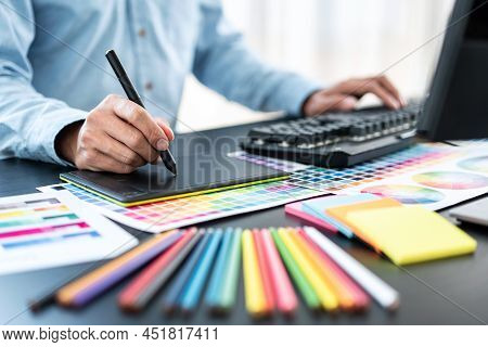 Young Creative Graphic Designer Working On Color Selection And Drawing On Graphics Tablet At Workpla