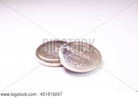 Brecht, Belgium - March 5 2022: A Studio Portrait Of Two Button Cell, Watch Or Coin Energizer Batter