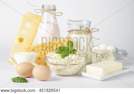Dairy Products, Milk, Yogurt, Sour Cream, Assorted Cheese, Cottage Cheese, Butter And Eggs On White 